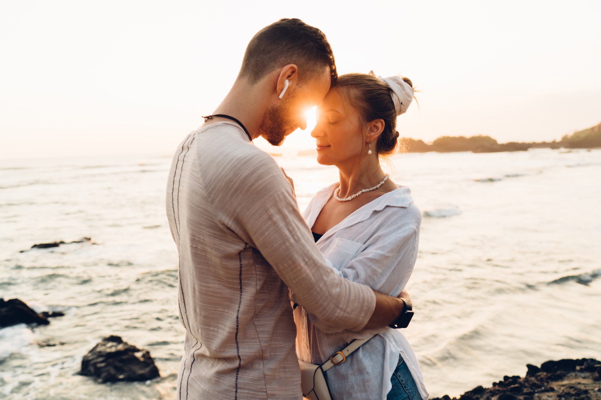 Tender lovers hugging near water